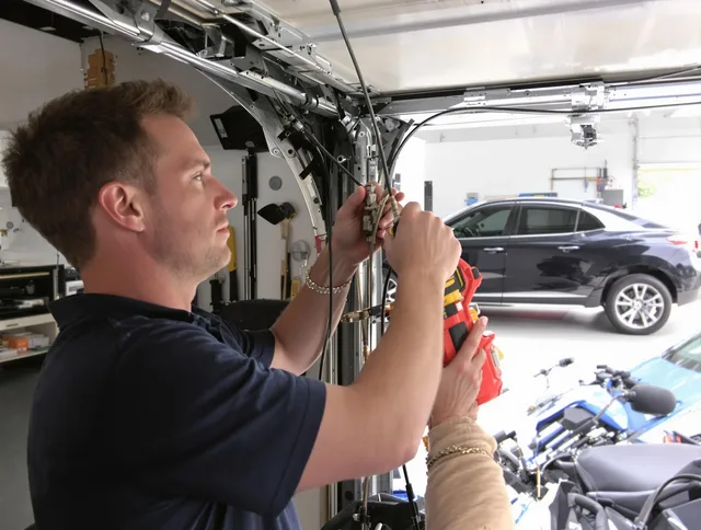 Duxbury Garage Door Repair safety certified technician performing cable replacement in Duxbury