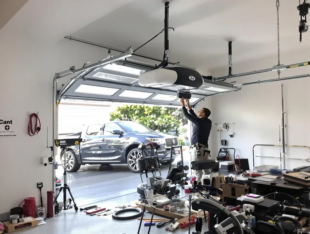 Duxbury Garage Door Repair specialist installing smart garage door opener system in Duxbury home