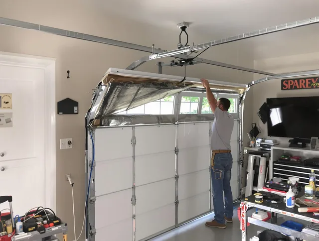 Garage door section replacement by Duxbury Garage Door Repair in Duxbury