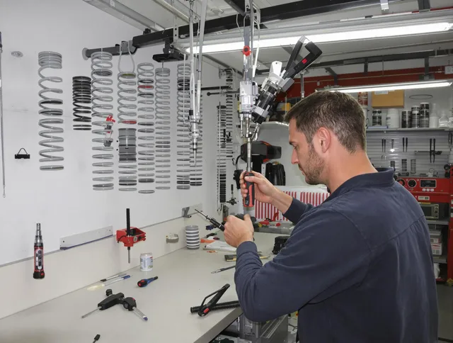 Duxbury Garage Door Repair safety certified technician performing precision spring replacement in Duxbury